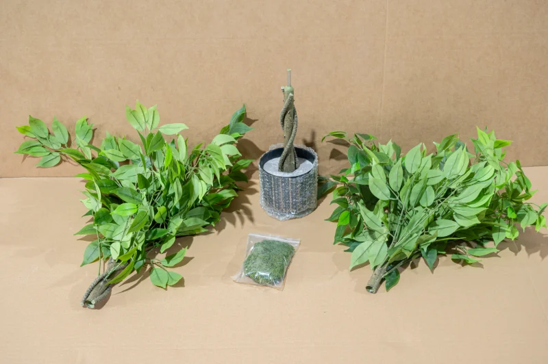 KD flat pack strategy for high volume sea freight of large artificial trees