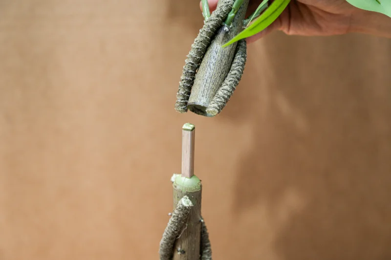 Metal snap fit trunk connectors for artificial tree assembly