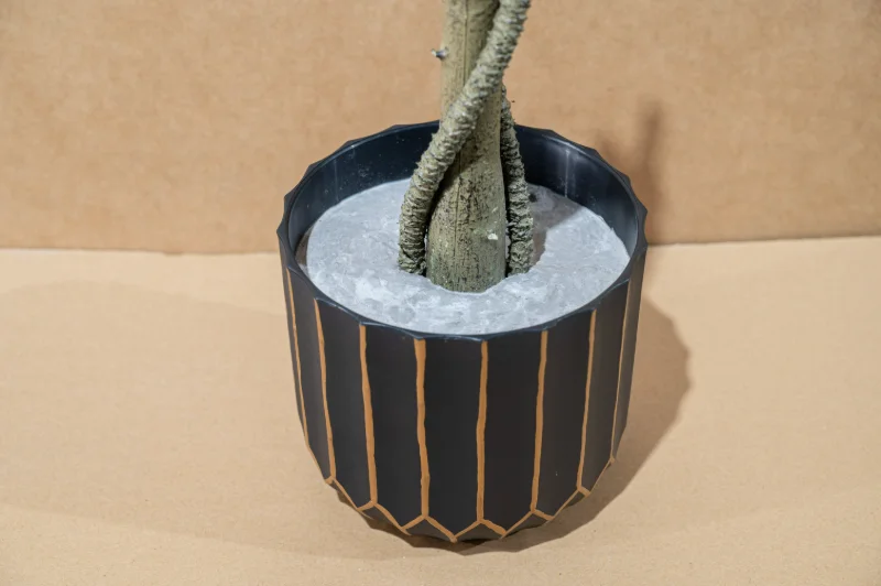 Weighted cement base pot providing stability for artificial trees